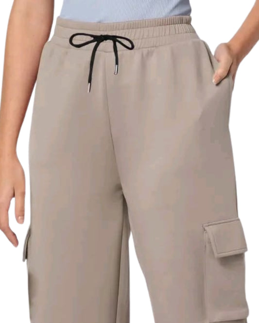 Beige cargo pants with a drawstring on a white background